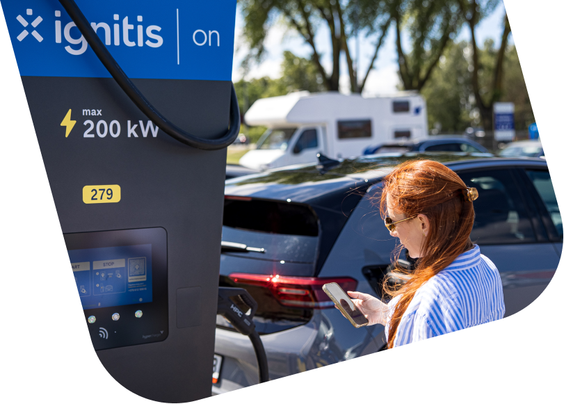Woman charging her EV at Ignitis ON charging station