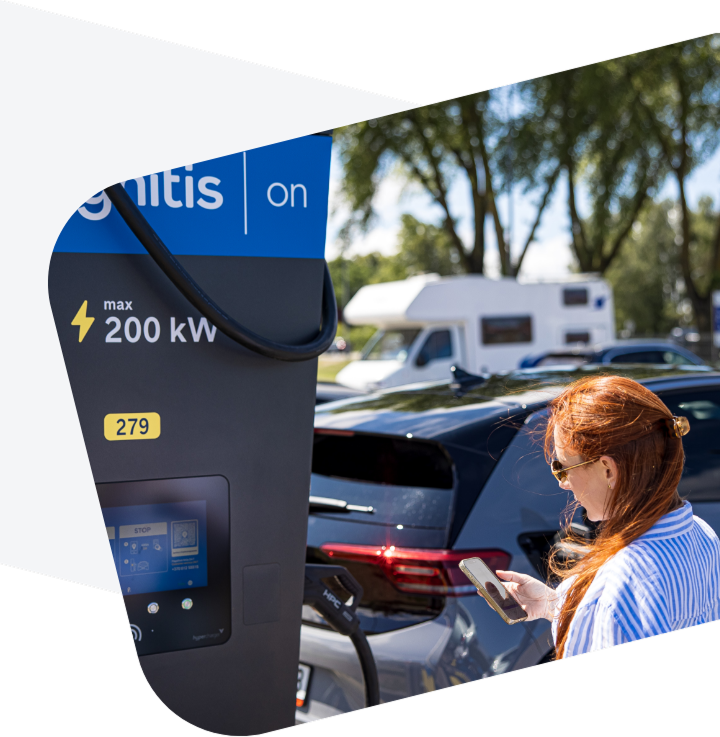 Woman charging her EV at Ignitis ON charging station