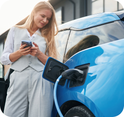 Woman charging electric car