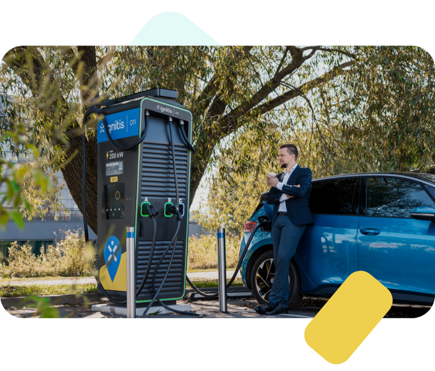 Man standing next to his EV and Ignitis ON charging station