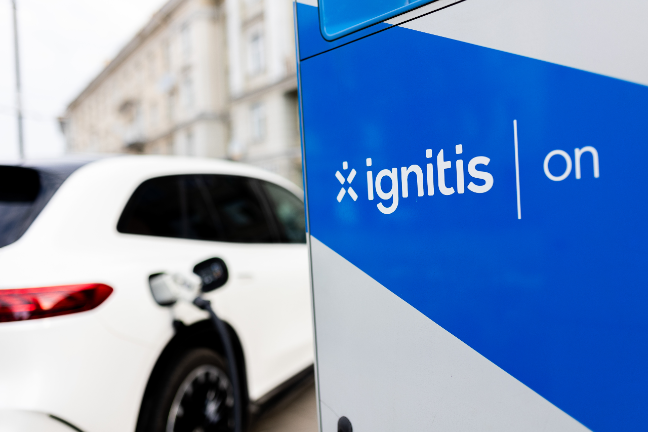 An electric car is charging at Ignitis ON station